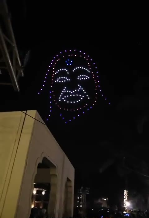 A smiling face drawn in drone light over the resort