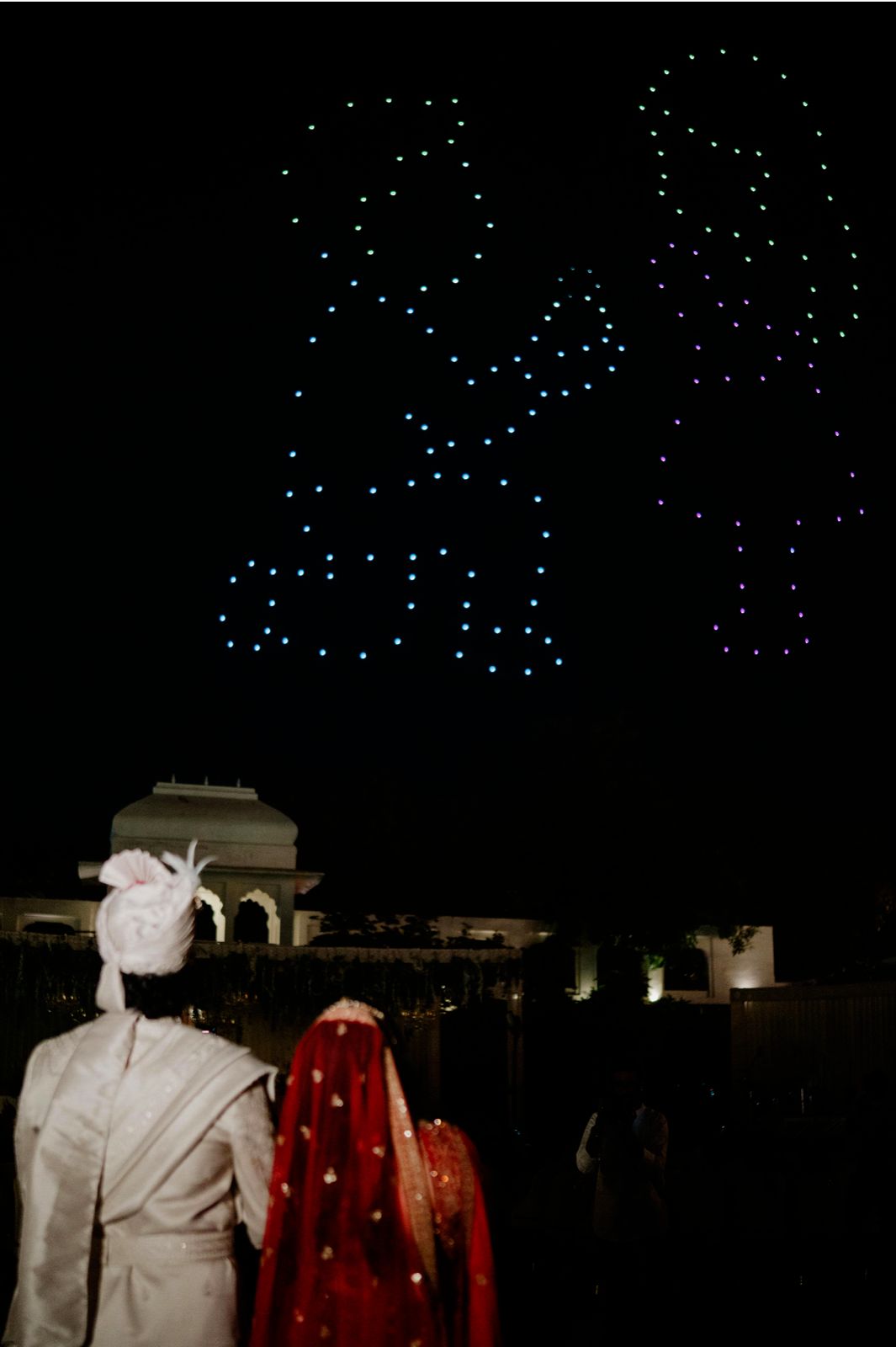 Multicolour couple silhouettes drone show